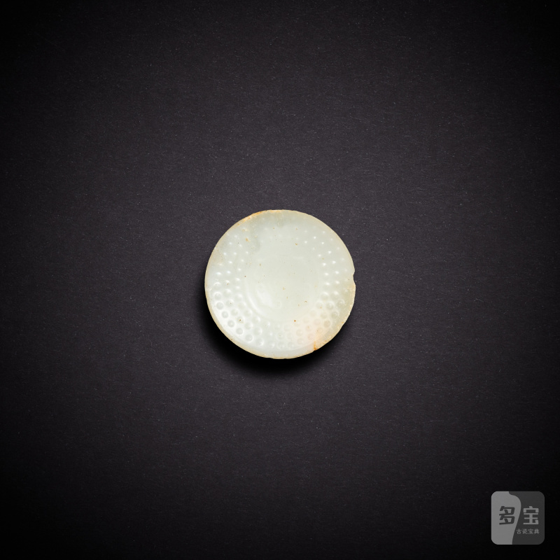 A white glass sword pommel, Western Han dynasty | 西漢 白琉璃雲紋劍首